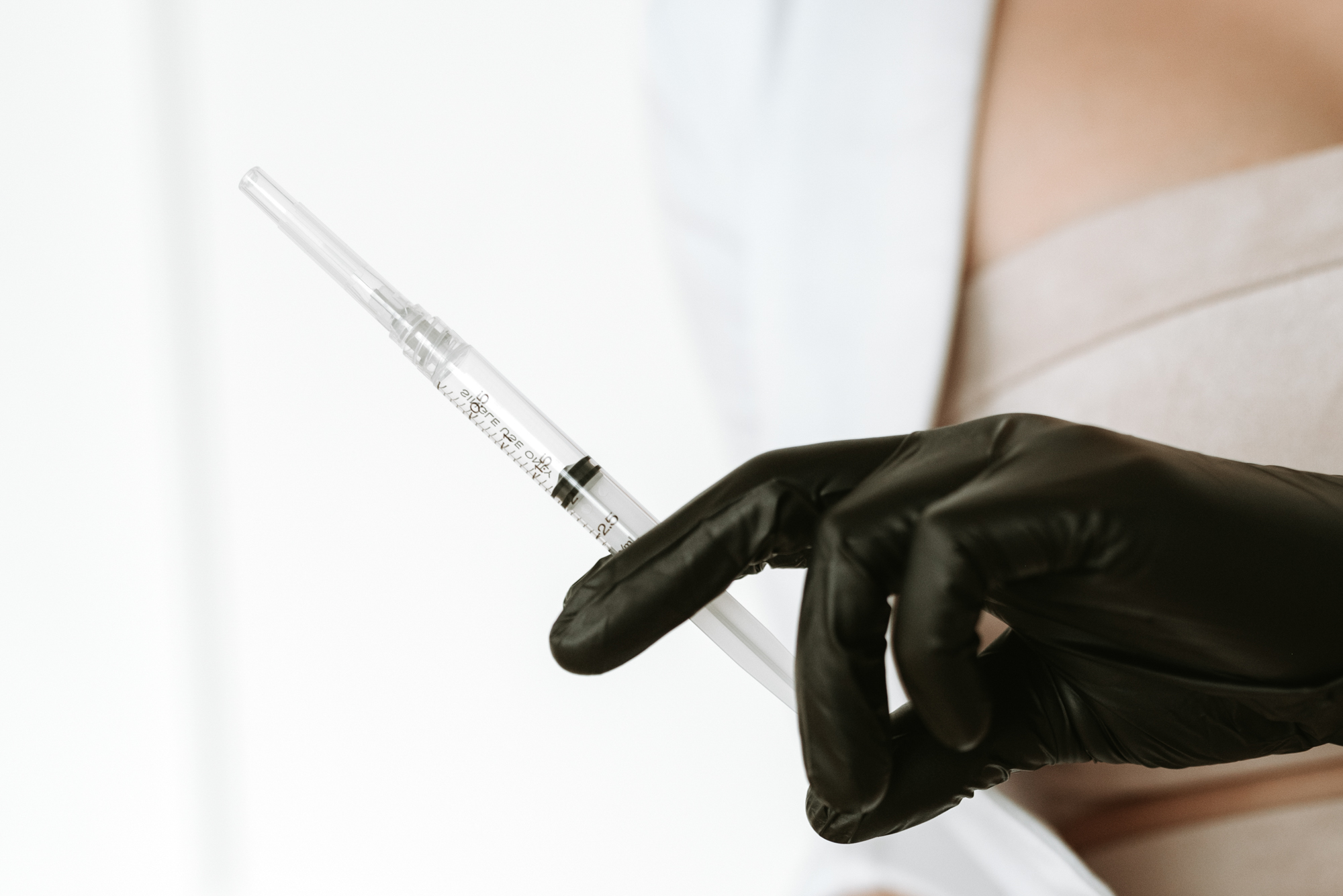 A Worthy injector prepares a syringe for masseter muscle Botox in Kitchener.