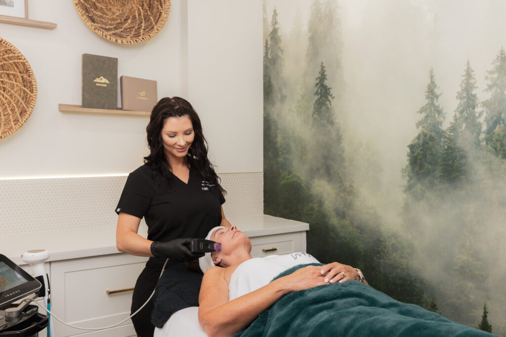 In one of our spa-like treatment rooms, a woman lies on a table, receiving Morpheus8 for facial rejuvenation in Waterloo, Ontario.