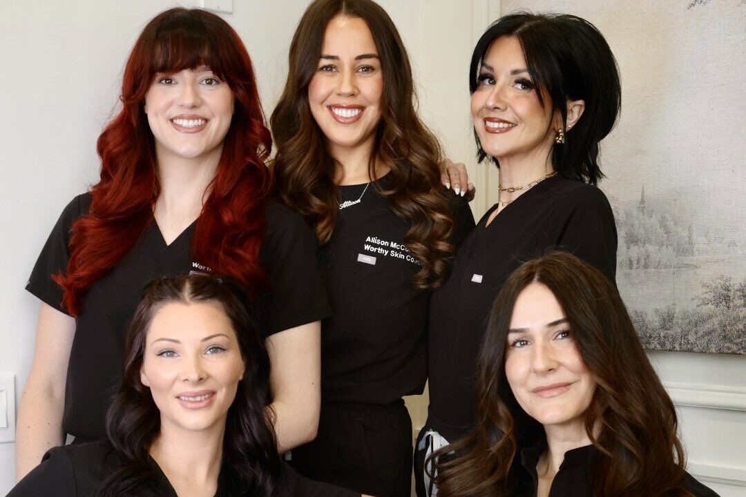 The Worthy team smiles, empowered by skilled providers capable of administering specialized treatments like masseter muscle Botox near Cambridge.