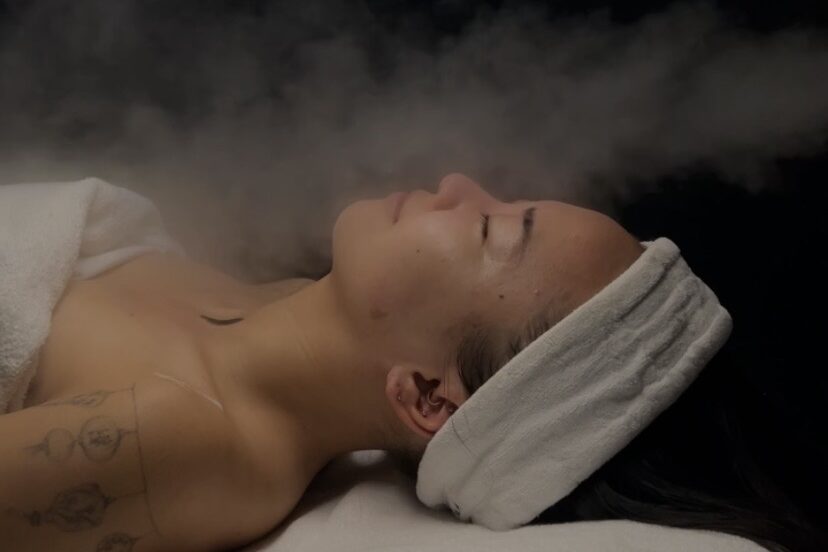 A patient relaxes in comfortable steam during a body acne treatment she paired with her laser hair removal near Kitchener.